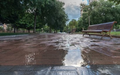 Waterproof surface coat deters water from walking path